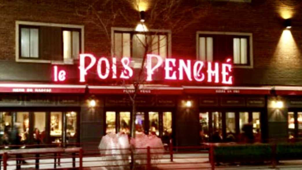 Un restaurant à Montréal avec une pancarte disant le pois penche.