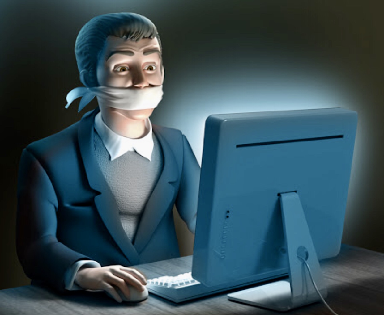Un homme en costume avec la bouche scotchée, assis devant un ordinateur, explorant les nouvelles technologies.