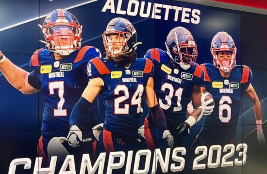 Une bannière célébrant la victoire des Alouettes comme champions en 2023 avec les mots « Alouettes Champions 2023 ».